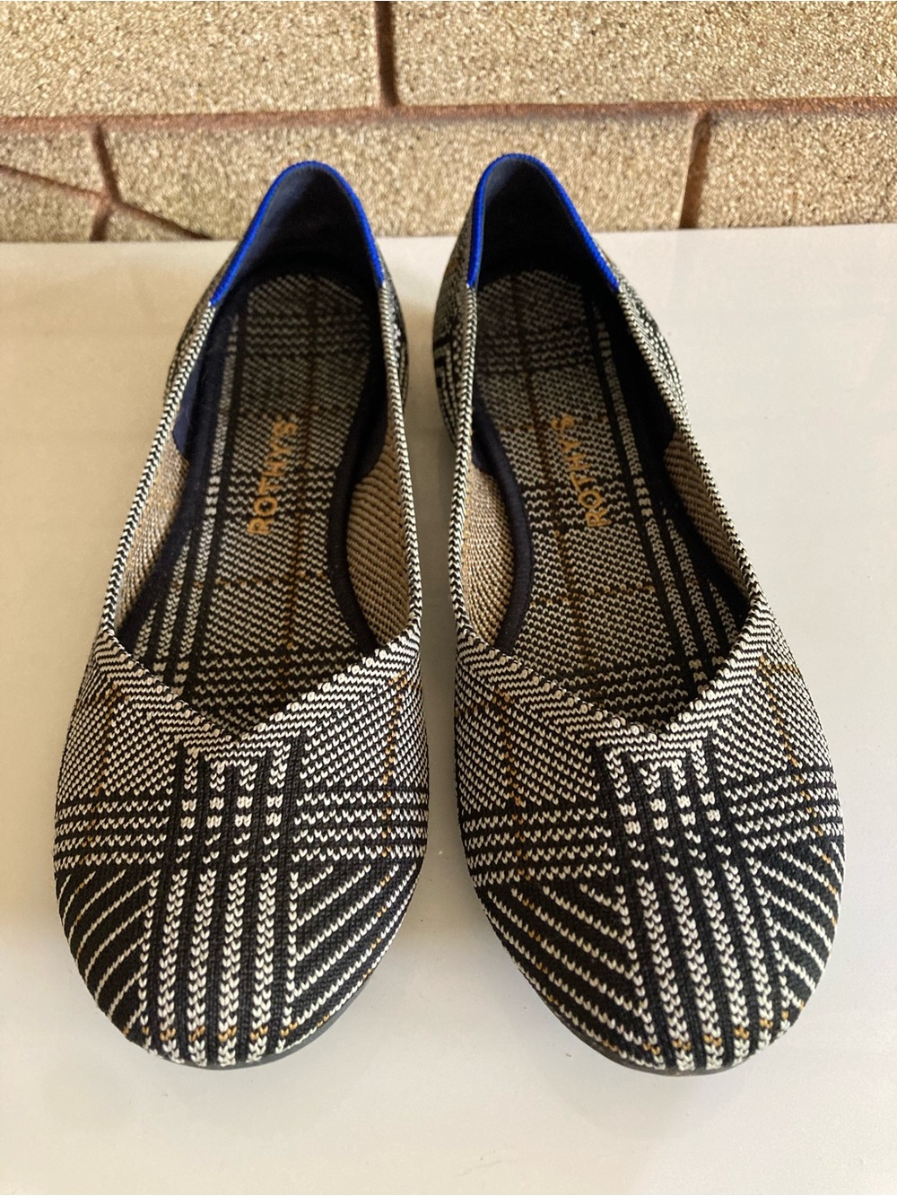 Rothy's Black and White Plaid Patterned Women's Slip-On Flats with Blue Trim